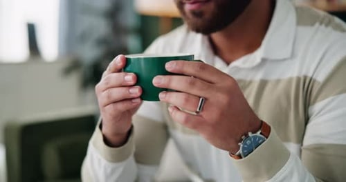 Man Holding Steaming Mug Close Up
