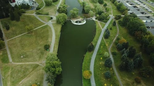 Flight In The City Park. River With Cascades And Waterfall. Aerial Photography.