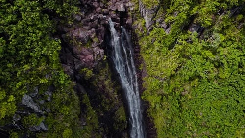 Rocky Cliff With Cascading Waterfall