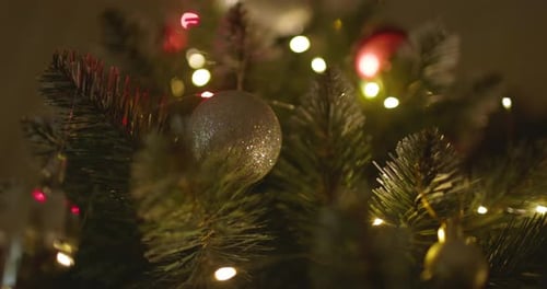 Happy New Year Christmas Tree Decorates on Branch Snow on Background Bokeh of Side Flickering Light