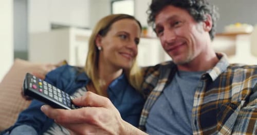 Couple Relaxing Together at Home with Remote Control