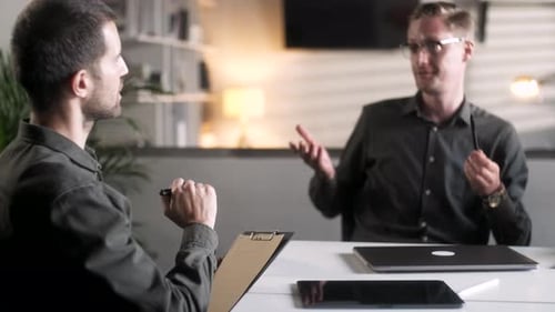 Businessmen Meeting in Office Discussing Project