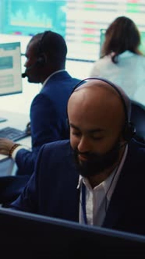 Office Workers at Desks Using Computers