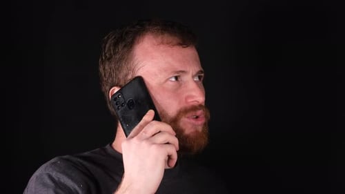 Bearded Man Talking on Phone Close Up