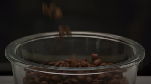 Roasted Coffee Beans Filling a Glass Jar