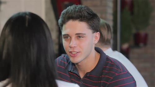 Close Up of a Young Man Drinks Beverage at the Bar