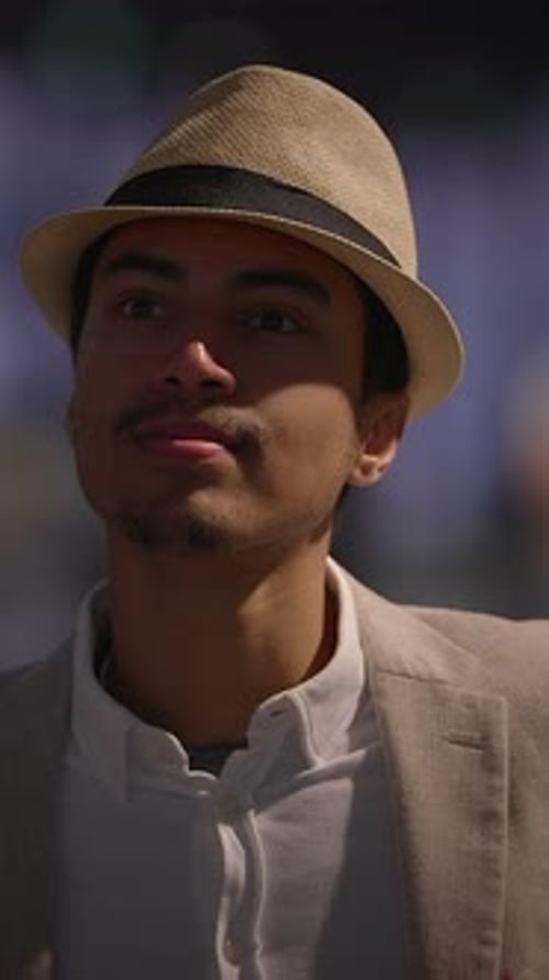 Man with Hat Jacket in City at Night