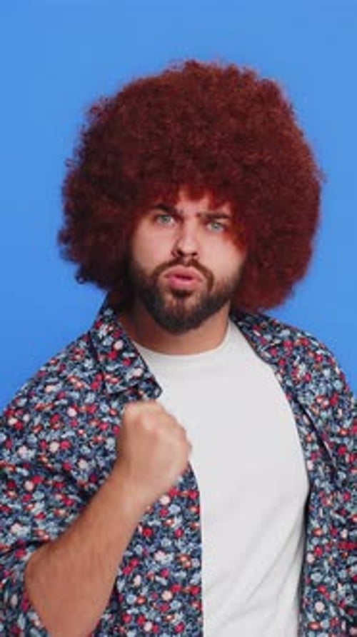 Man with Afro Gesturing and Emphasizing with Finger