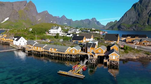 Lofoten Islands Norway Showcase a Stunning Sakrisoy Coastal Village Set Against Majestic Mountains