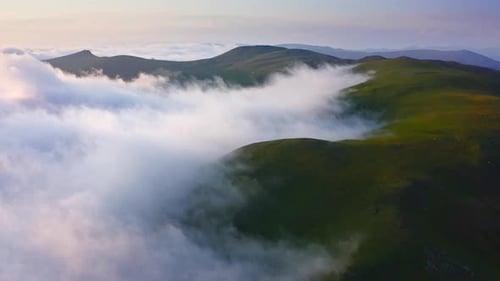 Cloud-Shrouded Mountain Hills At Sunset, Drone Shot Over Foggy Valley