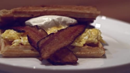 Delicious Breakfast Sandwich on Waffles and Bacon