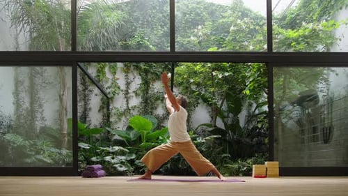 Man practicing leg lift outdoors with grounded focus
