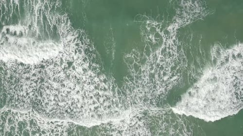Mesmerizing View of Ocean Waves and White Foam Creating Stunning Spectacle