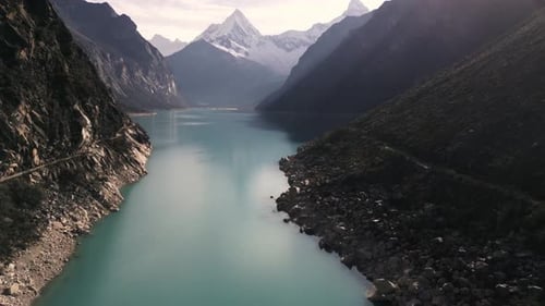 Drone Fly above Blue Peaceful Lake Snow Peak Mountain, Laguna Paron, Huaraz Peru Pristine Unpolluted