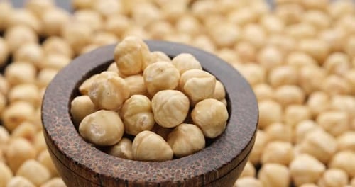 Whole Shelled Hazelnuts Nuts Kernels Closeup on Sliding Platform