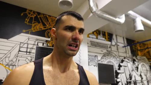 Strong Sporty Man Preparing to Hard Exercises with Weight at Modern Gym Athletic Guy Ready to Do