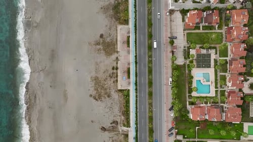 Aerial View Seafront Vintage Villas with a Beautiful Pool and Lush Palms Create a Picturesque