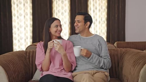 Loving Couple Enjoying Coffee Together at Home