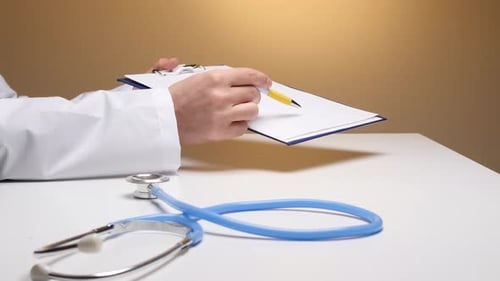 Medical Professional Writing on Clipboard with Stethoscope