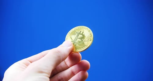 Hand Holding Gold Bitcoin Cryptocurrency Coin