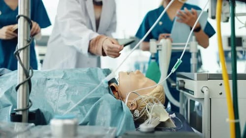 Healthcare, teaching and mannequin with people in hospital for patient simulation