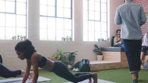 Yoga, teamwork and office with creative or design business people in the breakroom for collaboration