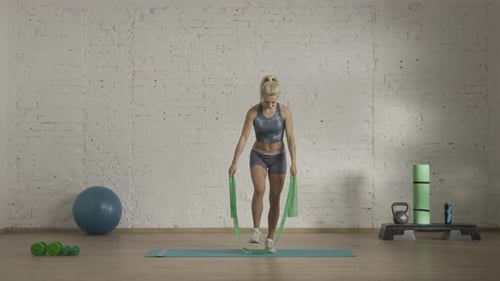 Woman Exercising with Resistance Band for Arm Workout