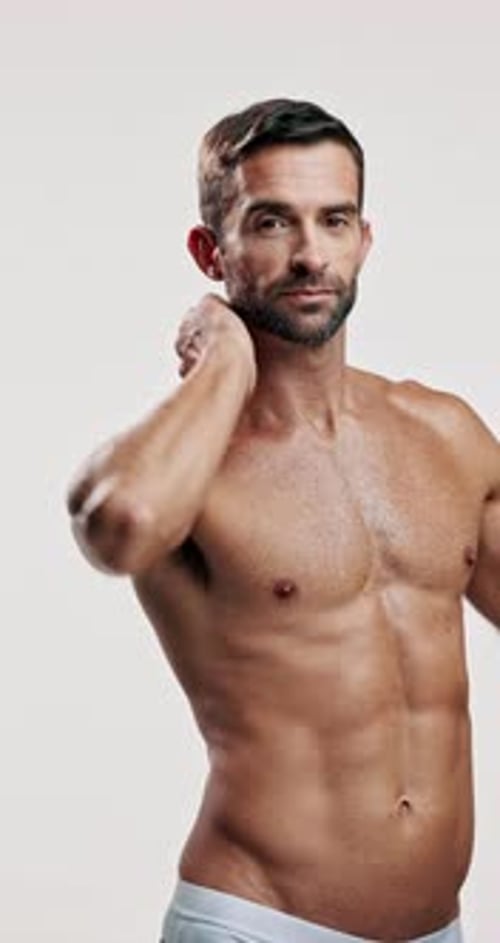 Studio, shirtless and body care for man, face and bodybuilder with muscle, fitness and healthy