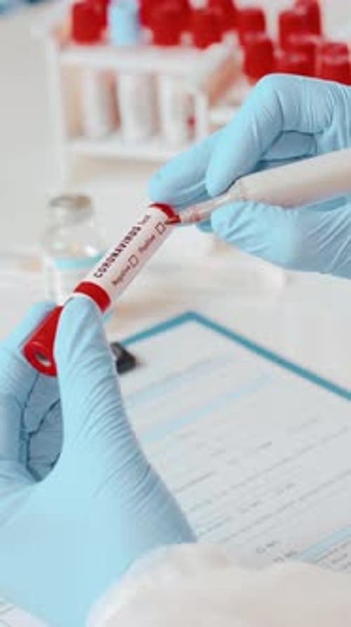 Medical Worker Analyzing Coronavirus Negative Blood Test