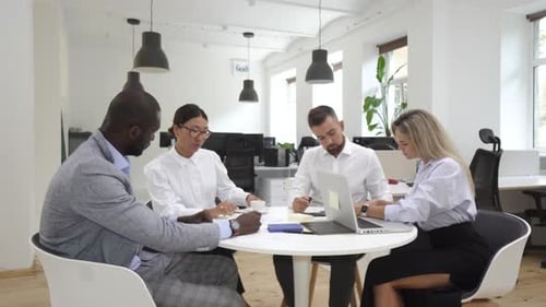 Multiethnic Business People During Meeting in Modern Office