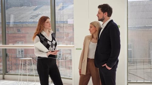 Business Team Meeting by the Office Window