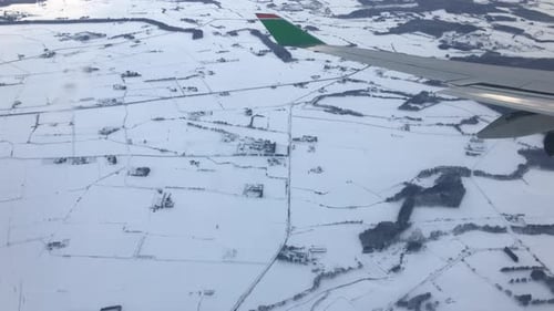 airplane wing above land of Hokkaido, Japan