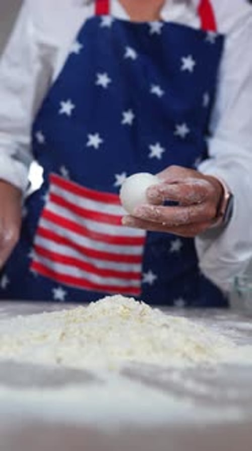 Cracking Egg Over Flour For Home Baking