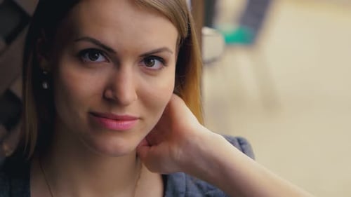 Attractive Young Woman Smiling and Posing Close-Up