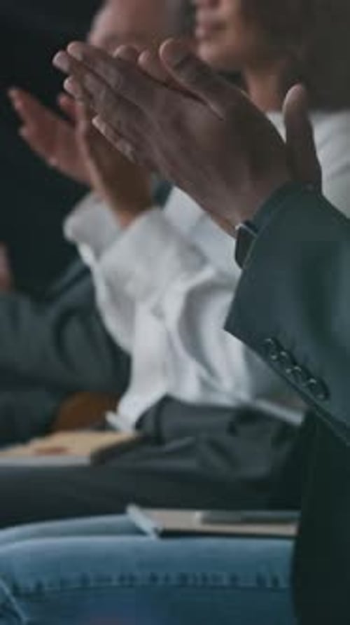 Business People Clapping Hands At Conference