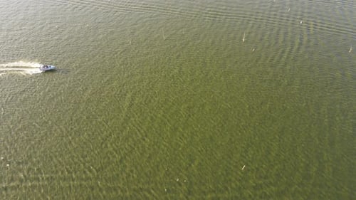 Aerial view of speedboat in shallow water. Travel and leisure activities concept