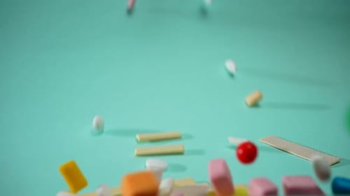 Colored Chewing Gum and Refreshing Candy Drop on Blue Backgroundnobody
