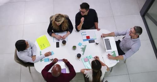 Top view, meeting and business people in office for planning, strategy and creative teamwork