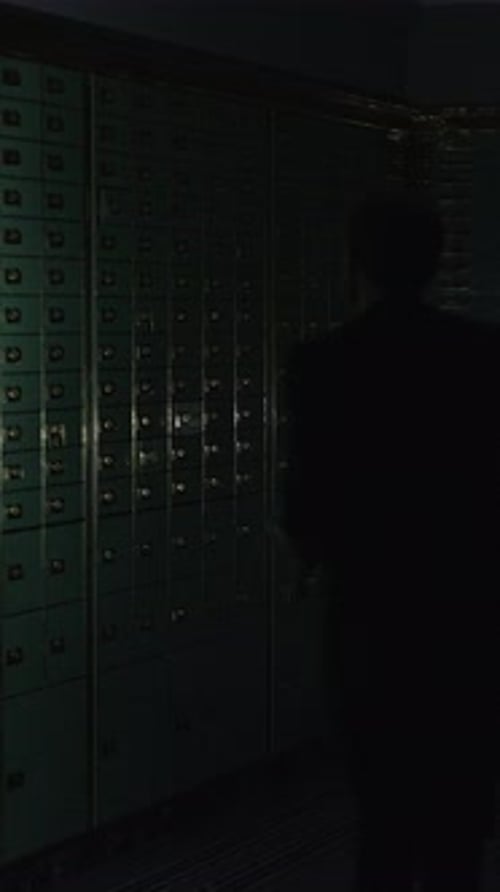 A Dark Figure Behind Iron Bars in a Dim Space Creates an Unsettling Tension in the Air