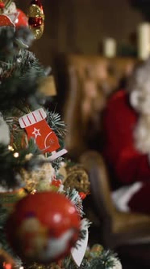 Vertical of Santa Claus Working with Tablet PC digitalPAD