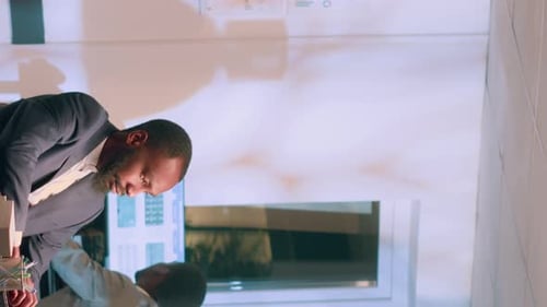 Professional man works in bright office environment