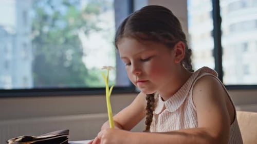 Little Schoolgirl Writing Lesson Listening Unknown Teacher in School Closeup