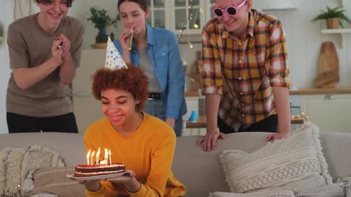 Friends Celebrate Birthday Together Indoors with Cake