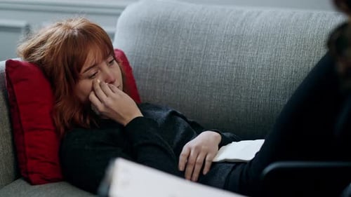 Unhappy Young Lady Crying and Talking to Her Personal Psychologist Psychotherapist Appointment