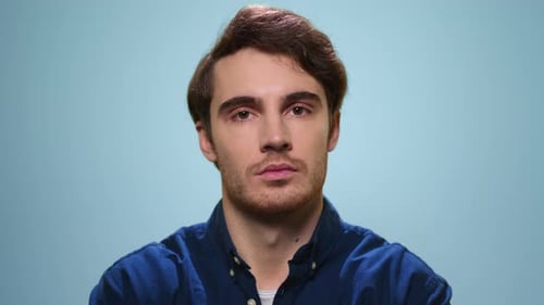 Portrait of Serious Man Waving Head No at Camera. Displeased Man Posing