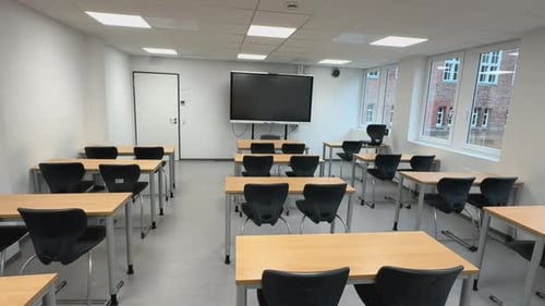 Empty Classroom with Desks and Monitor