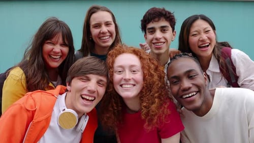 Smiling Teens and Young Adults Pose for Portrait