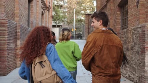 Young Adults Walking and Smiling on City Street