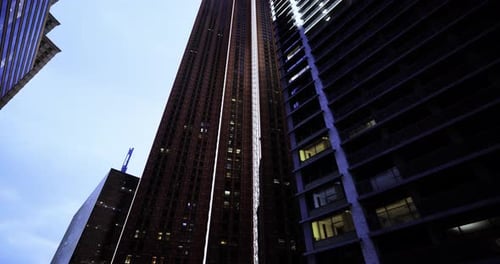 Dusk Lit Skyscrapers with Contrasting Architecture in an Urban Scene