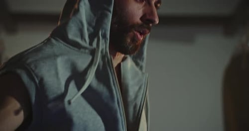 Active Man Jumping Skipping Rope in Sport Club